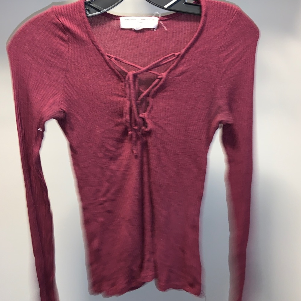 Long sleeve burgundy shirt with a lace up front